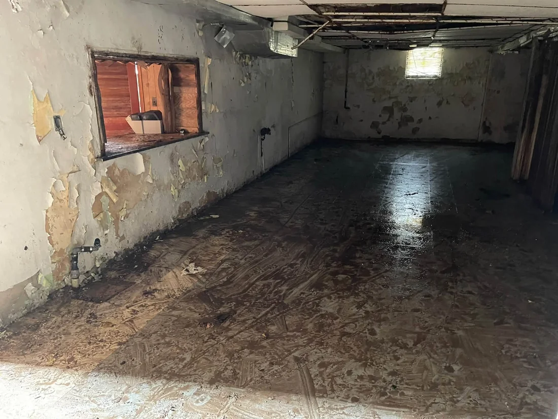 Same interior area with furniture and loose debris cleared from the floor